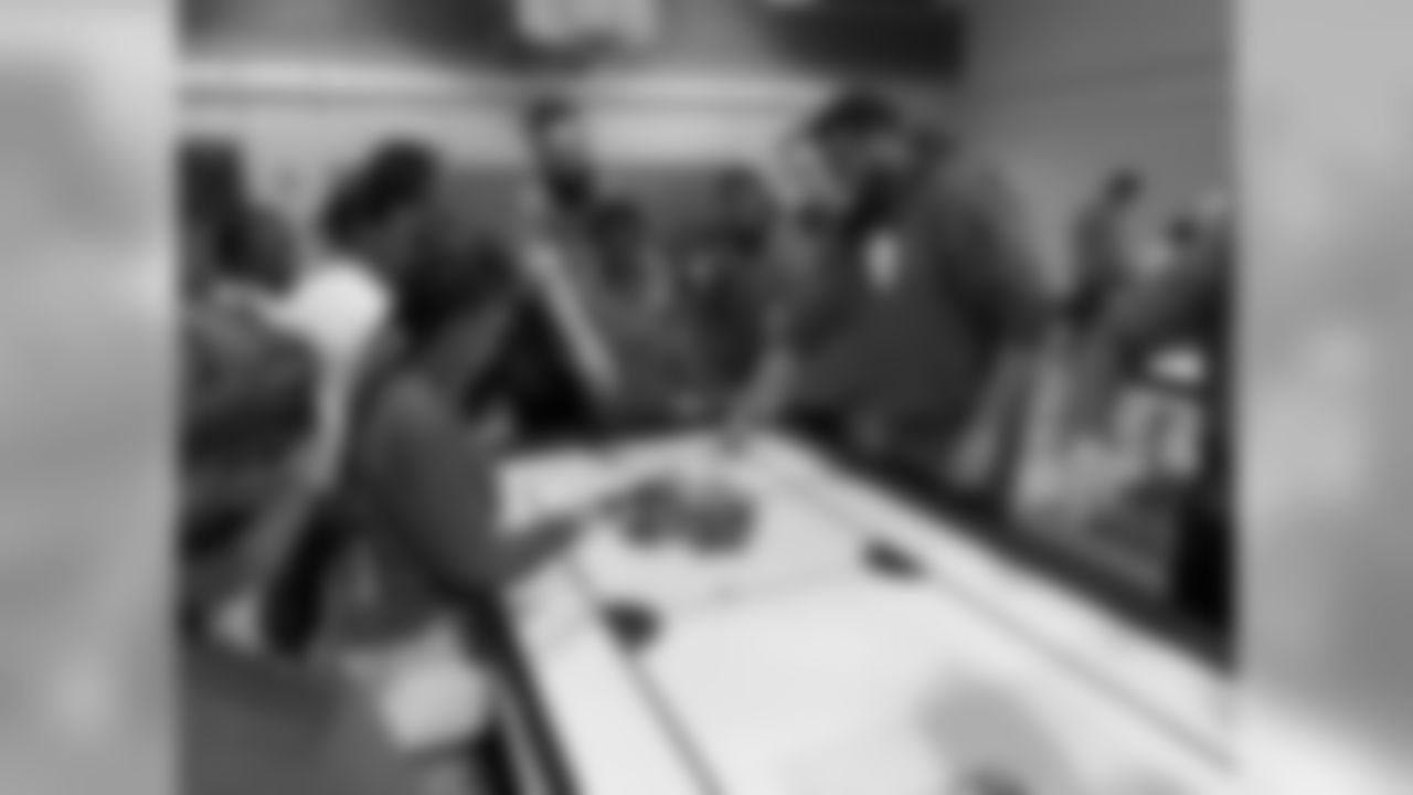 Detroit Lions center Leo Koloamatangi (75) builds robots with students at Detroit Lions Academy on Tuesday, Dec. 11, 2018 in Detroit.