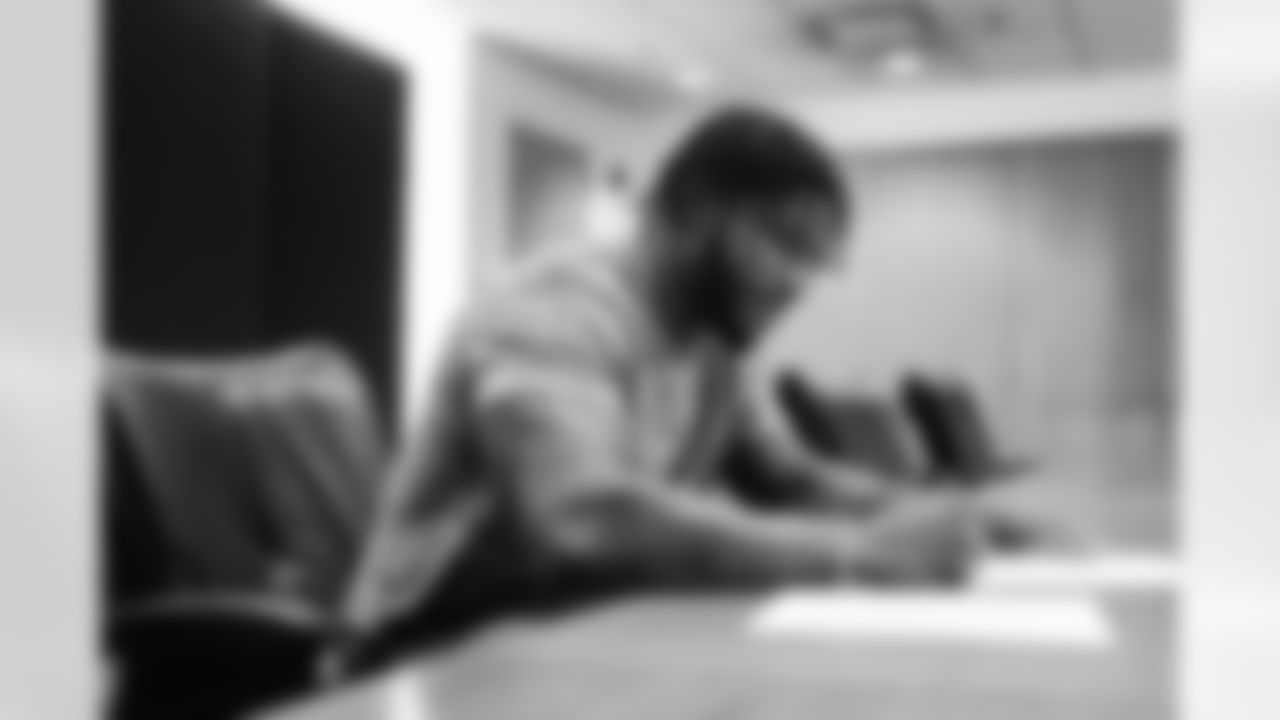 Detroit Lions linebacker Chris Board signing his contract at the Lions Training Facility in Allen Park, MI on March 23, 2022. (Josh Mandujano/Detroit Lions)