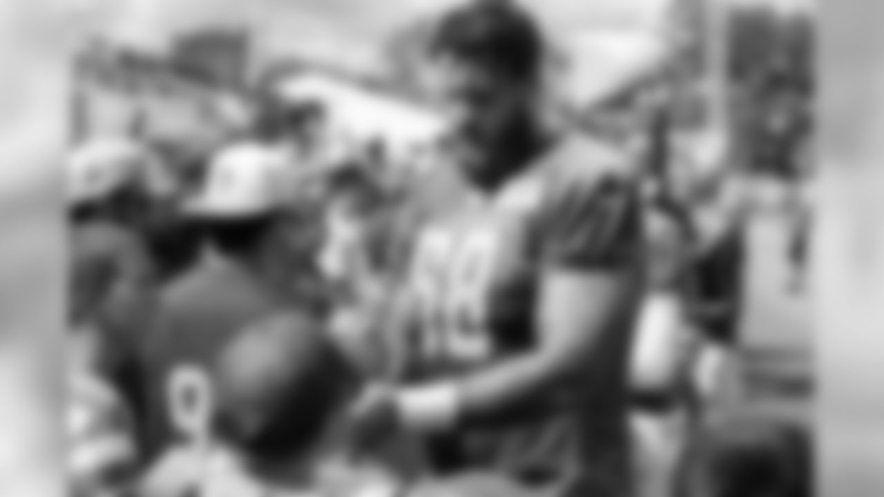 Detroit Lions tackle Taylor Decker (68) signs autographs for fans following Day 12 of 2019 Detroit Lions Training Camp presented by Rocket Mortgage on Wednesday, Aug. 7, 2019 in Allen Park, Mich. (Detroit Lions via AP)
