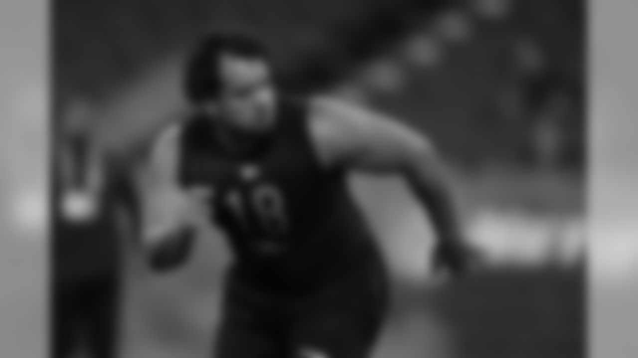 Utah defensive lineman John Penisini runs a drill at the NFL football scouting combine in Indianapolis, Saturday, Feb. 29, 2020. (AP Photo/Charlie Neibergall)
