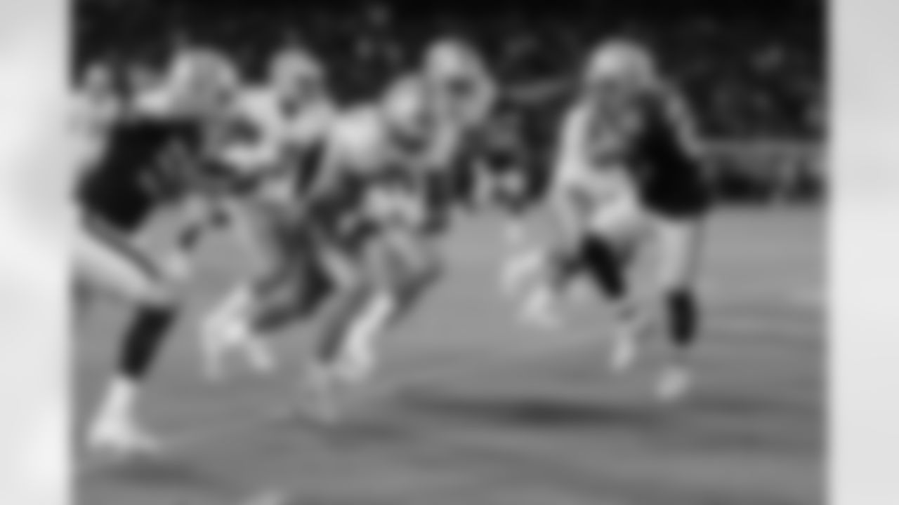 Detroit Lions running back Kerryon Johnson (33) takes a screen pass for a 19-yard gain during a NFL football game against the Oakland Raiders on Friday, Aug. 10, 2018 in Oakland, Calif. (Detroit Lions via AP).