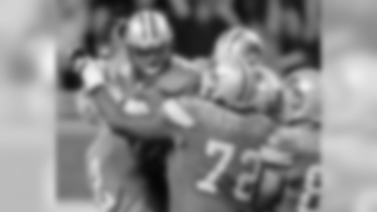Detroit Lions kicker Jason Hanson (4), upper left, celebrates with teammates Nick Harris (2), George Foster (72) and Casey FitzSimmons (82) after kicking a 37-yard field goal in overtime to beat the Minnesota Vikings, 20-17, in a football game Sunday, Sept. 16, 2007, in Detroit. (AP Photo/Duane Burleson)