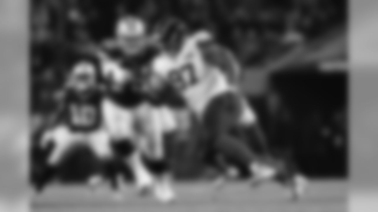 Chicago Bears defensive tackle Nick Williams (97) runs around the edge as Dallas Cowboys offensive guard Zack Martin (70) blocks during an NFL football game, Thursday, Dec. 5, 2019, in Chicago. Chicago won 31-24. (Aaron M. Sprecher via AP)