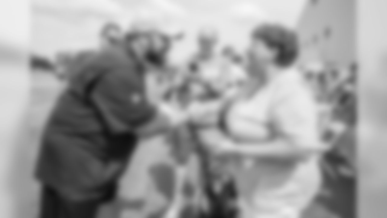 Detroit Lions head coach Matt Patricia vists with a guest from Team Joseph following training camp practice on Monday, July 30, 2018 in Allen Park, Mich. (Detroit Lions via AP)