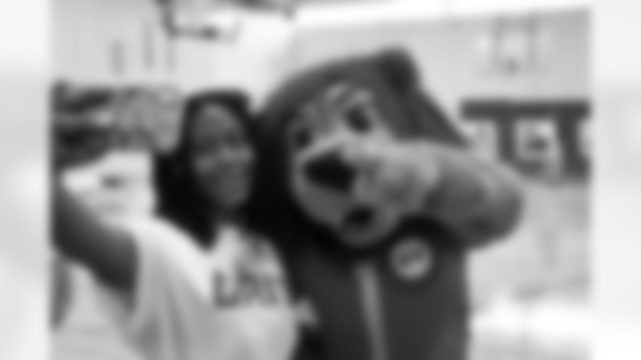 Detroit Lions Mascot Roary and DLA student taking a selfie during the Detroit Lions Academy Opening Ceremony in Detroit, MI on September 19, 2023. (Steven Stark / Detroit Lions)