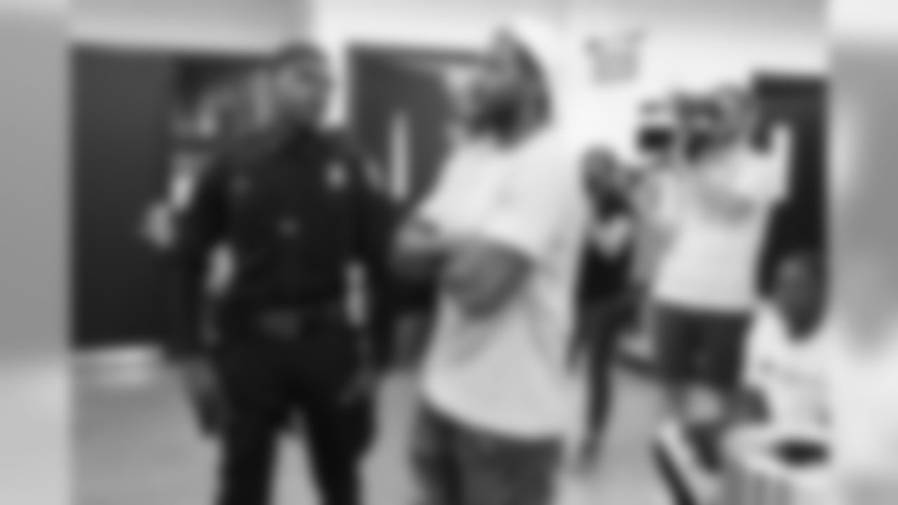 Tavon Wilson visits with participants for a conversation on social resilience at on Thursday, June 7, 2019 in Detroit.