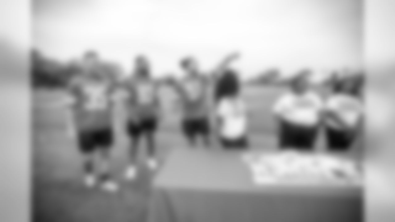 Detroit Lions safety Miles Killebrew (35), Detroit Lions defensive lineman Da'Shawn Hand (93) and Detroit Lions linebacker Jahlani Tavai (51) help build rockets with students from Detroit Lions Academy as part of Season Launch Week presented by Rocket Mortgage Tuesday, Sept. 10, 2019 in Allen Park, Mich.