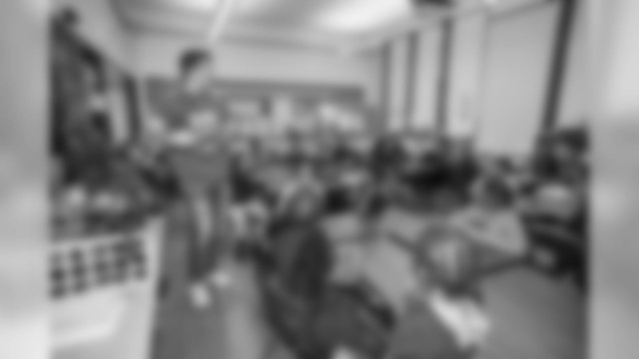 Detroit Lions quarterback David Blough (10) distributes gifts to students at Mary McLeod Bethune Elementary-Middle School Tuesday, Dec. 10, 2019 in Detroit.