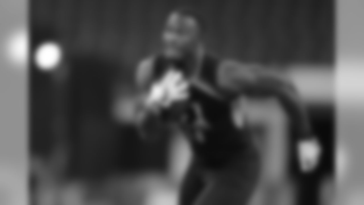 LSU linebacker Devin White runs a drill at the NFL football scouting combine in Indianapolis, Sunday, March 3, 2019. (AP Photo/Michael Conroy)