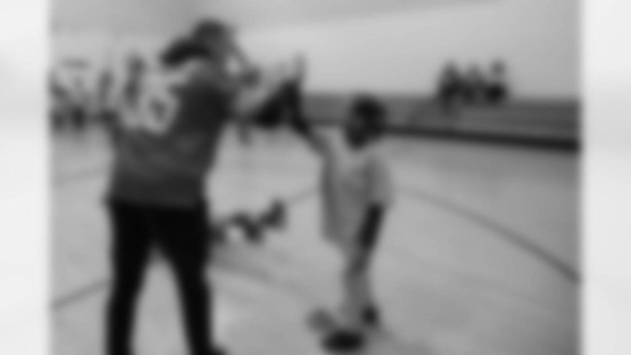 Detroit Lions safety Miles Killebrew (35) high fives a student at a real players don't bully assembly with Playworks at Hutchinson Elementary School on Tuesday, Oct. 22, 2018 in Detroit.