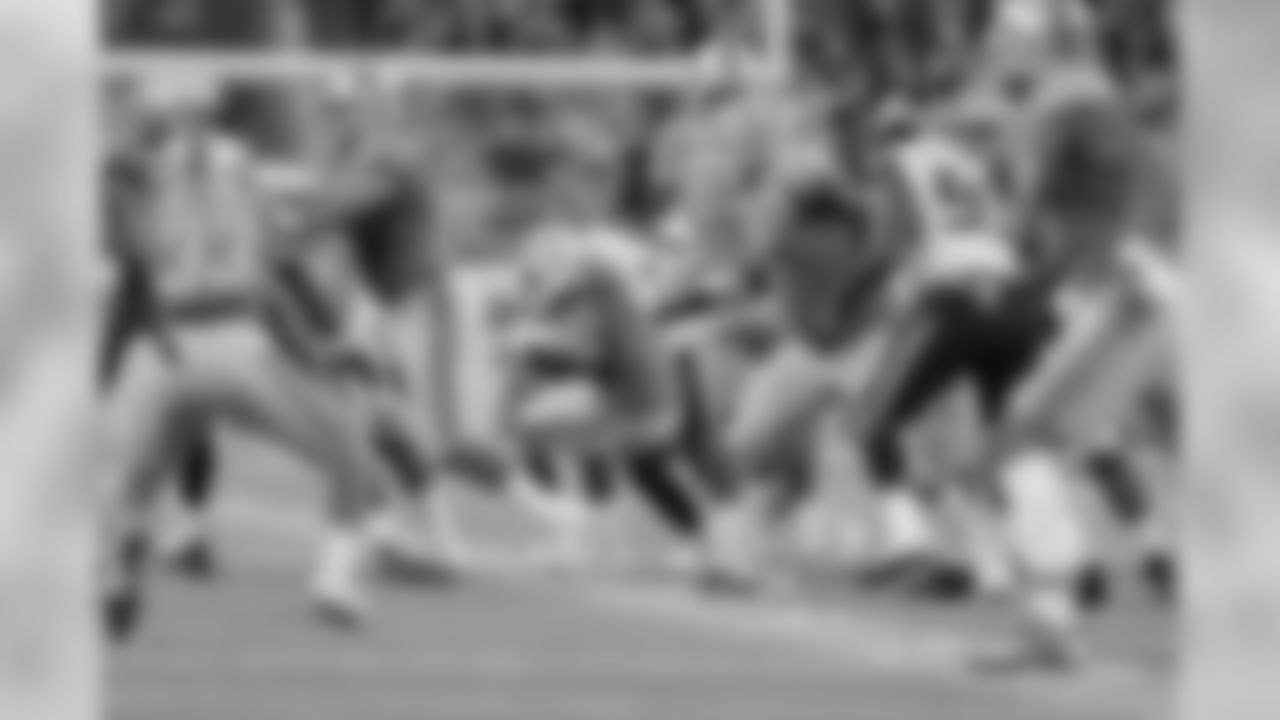 Detroit Lions quarterback Matthew Stafford (9) avoids the rush before throwing a touchdown pass during a NFL football game against the Seattle Seahawks on Sunday, Oct. 28, 2018 in Detroit. (Detroit Lions via AP).