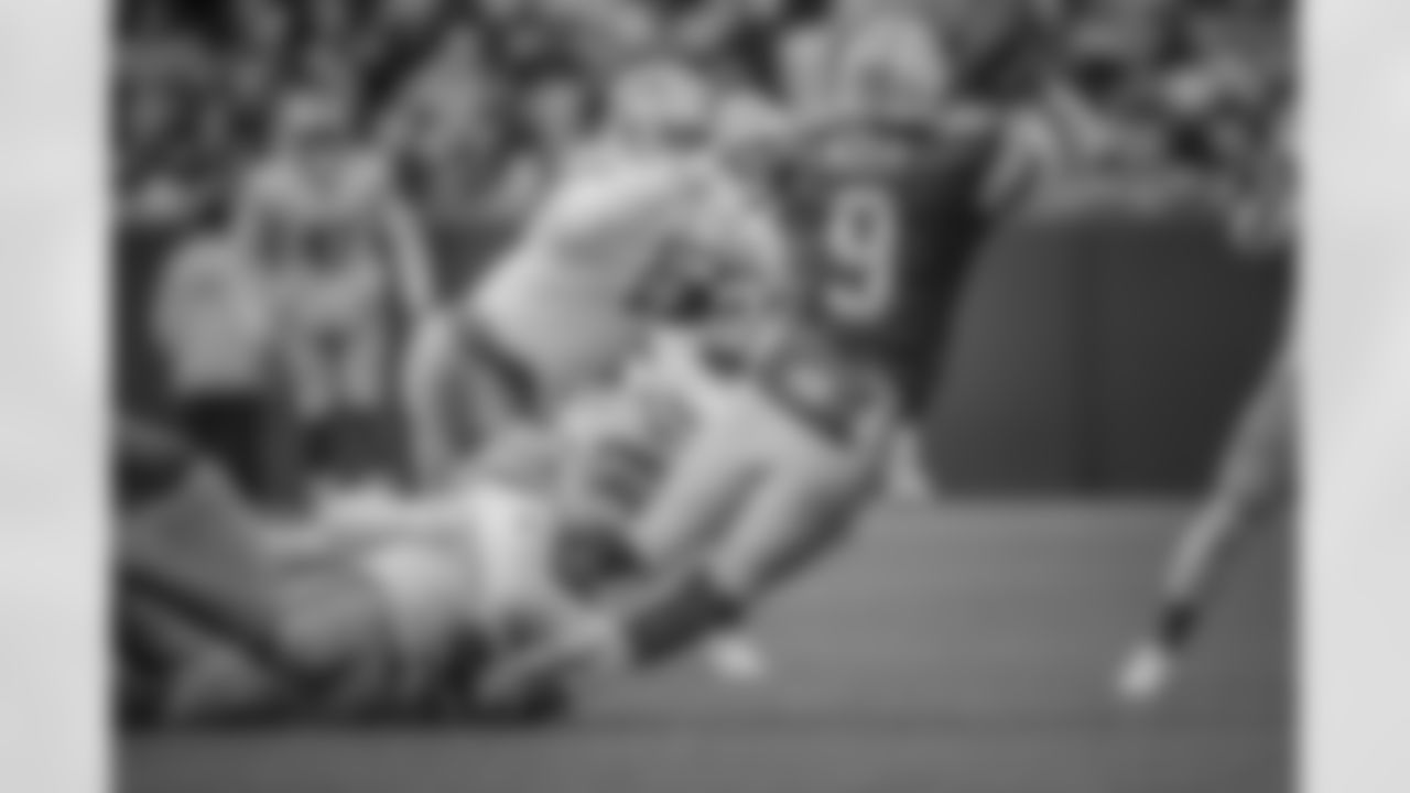 Detroit Lions defensive end Romeo Okwara (95) and Detroit Lions defensive end Kerry Hyder Jr. (61) pressure Green Bay Packers quarterback DeShone Kizer (9) into an interception during a NFL football game against the Green Bay Packers on Sunday, Dec. 30, 2018 in Green Bay, Wisc.