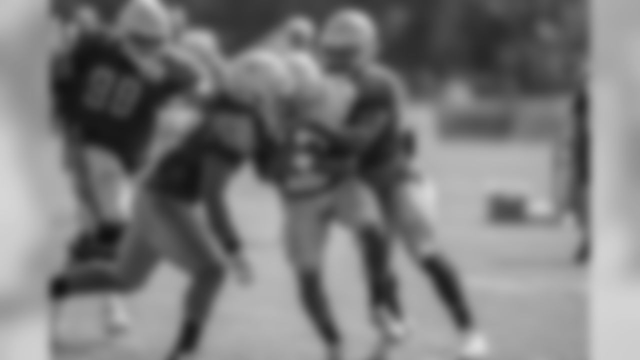 Detroit Lions linebacker Steve Longa (54) wraps up running back Kerryon Johnson (33) in the backfield during training camp practice on Thursday, Aug. 2, 2018 in Allen Park, Mich. (Detroit Lions via AP)