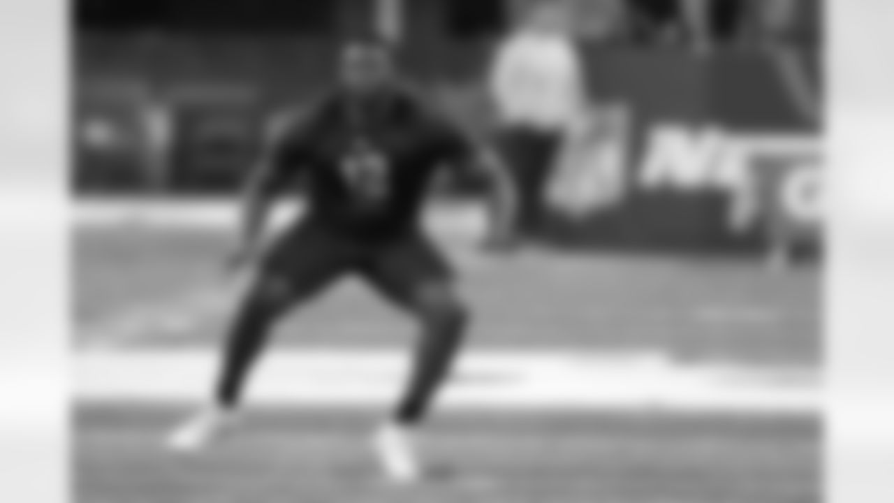 North Carolina State offensive lineman Ickey Ekwonu runs a drill during the NFL football scouting combine, Friday, March 4, 2022, in Indianapolis. (AP Photo/Darron Cummings)