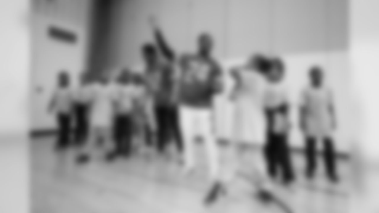 Detroit Lions cornerback Nevin Lawson (24) gives some throwing tips at a real players don't bully assembly with Playworks at Hutchinson Elementary School on Tuesday, Oct. 22, 2018 in Detroit.