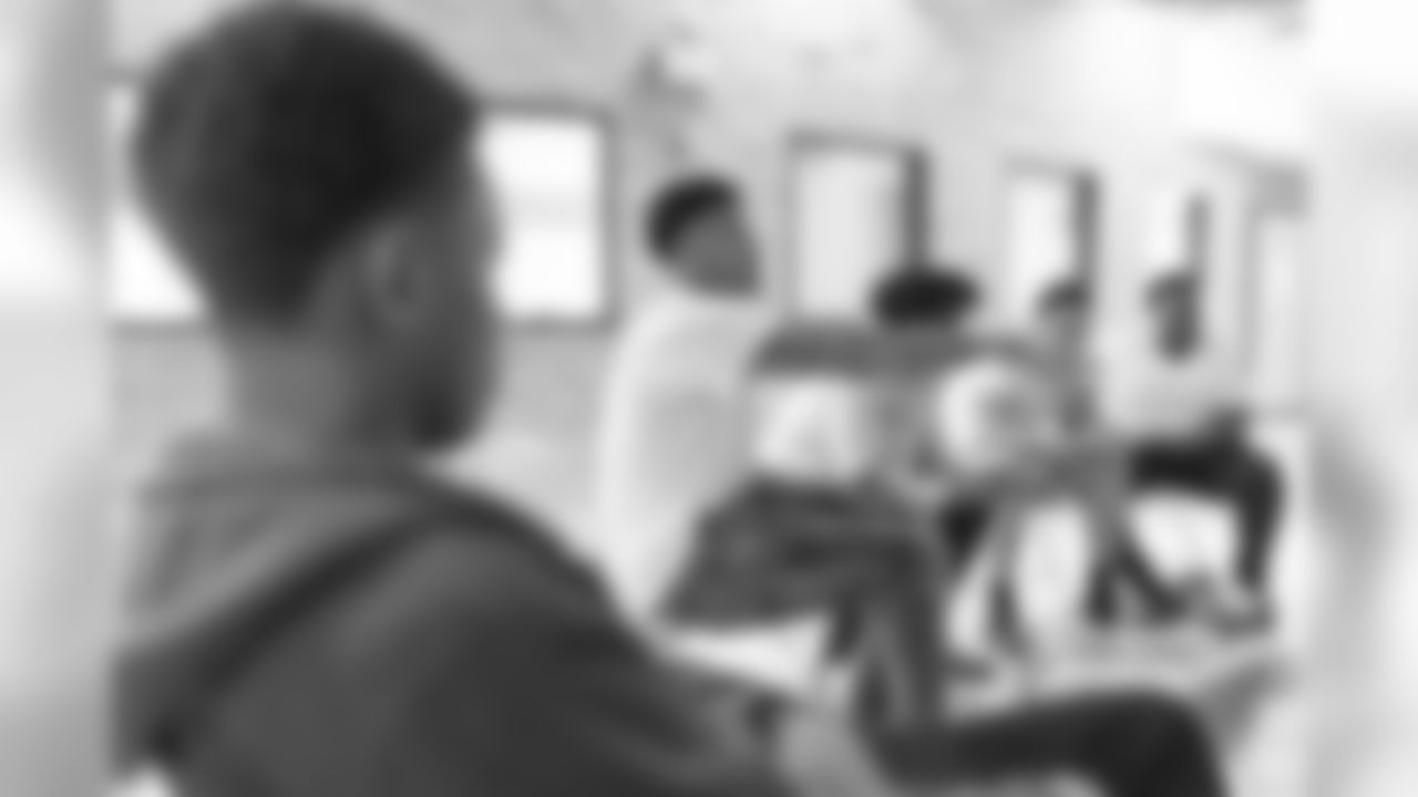 Teez Tabor visits with participants for a conversation on social resilience at on Thursday, June 7, 2019 in Detroit.