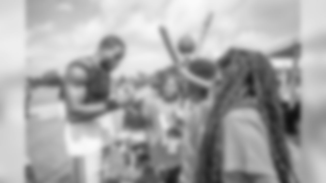 Detroit Lions safety Tavon Wilson (32) visits with guests from Downtown Boxing Gym on Day 6 of Detroit Lions Training Camp presented by Rocket Mortgage on Wednesday, July 31, 2019 in Allen Park, Mich.