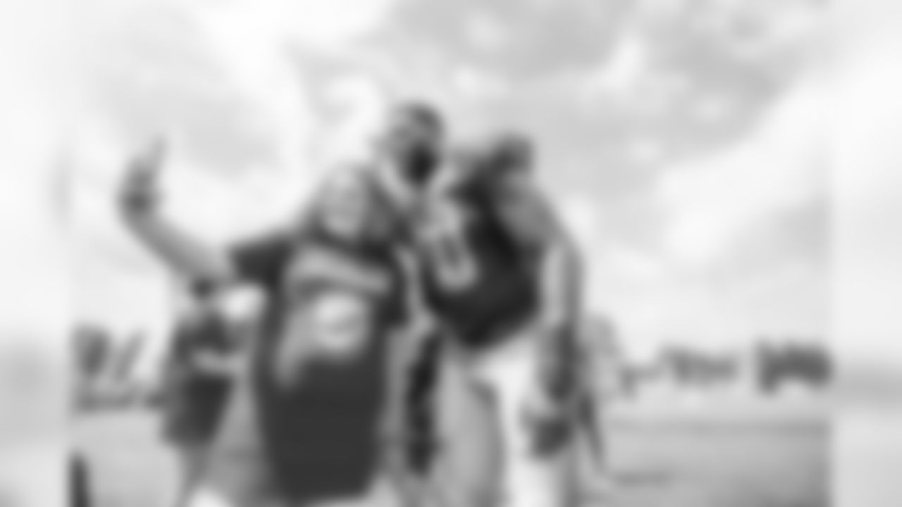 Detroit Lions linebacker Jarrad Davis (40) takes a selfie with guests from TAPS during Day 6 of Detroit Lions Training Camp presented by Rocket Mortgage on Wednesday, July 31, 2019 in Allen Park, Mich.