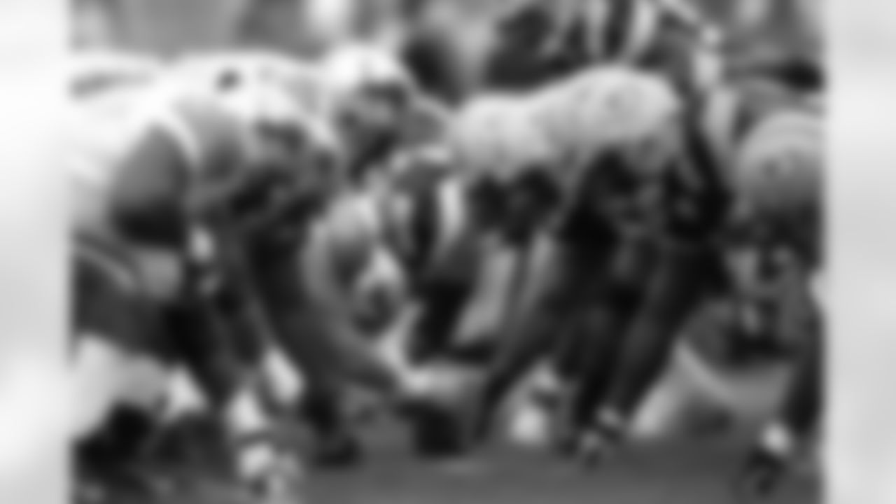 Detroit Lions and Green Bay Packers players line up at the line of scrimmage during a Week 2 NFL football game between the Detroit Lions against the Green Bay Packers at Lambeau Field in Green Bay, Wisconsin on September 14, 2003. The Packers defeated the Lions 31-6. (AP Photo/Scott Boehm)