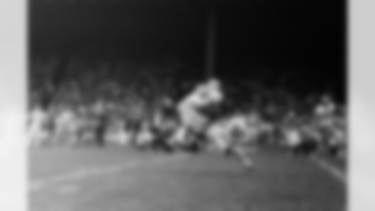 Detroit Lions Pat Studstill (25) dives for a pass from quarterback Milt Plum and as he missed looks like he is putting a flying block on defending Green Bay Packers? back Herb Adderley (26) in this first half action in game at Detroit on Sunday, Oct. 9, 1967. Both let the ball get away. Green Bay defeated Detroit 27-17. (AP Photo/AQ)