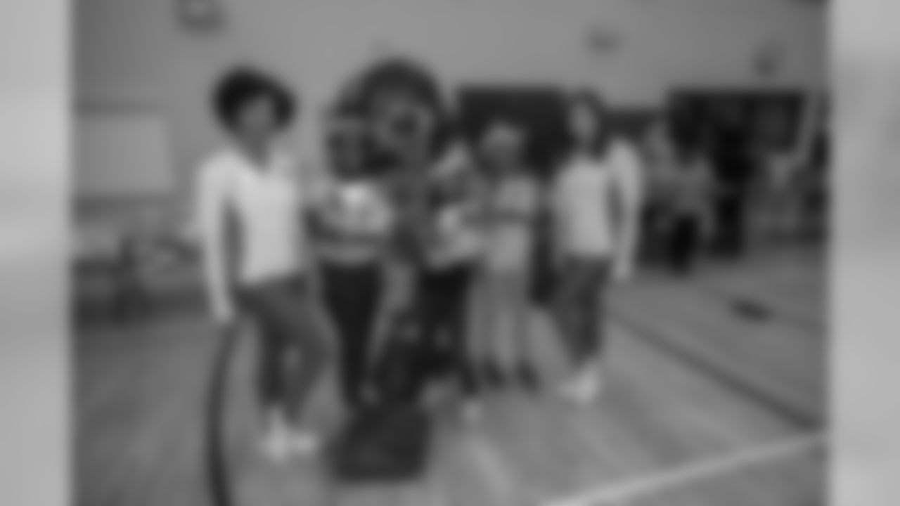 Detroit Lions Cheerleaders distribute gifts to students at Mary McLeod Bethune Elementary-Middle School Tuesday, Dec. 10, 2019 in Detroit.