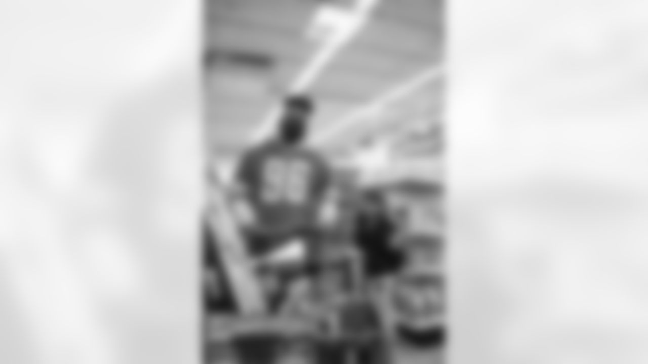 Detroit Lions defensive end Jashon Cornell (96) and Students from Boys and Girls Club go on a shopping spree with the help of the Detroit Lions at Meijer in Detroit, MI on December 7th, 2021. (Steven Stark/Detroit Lions)
