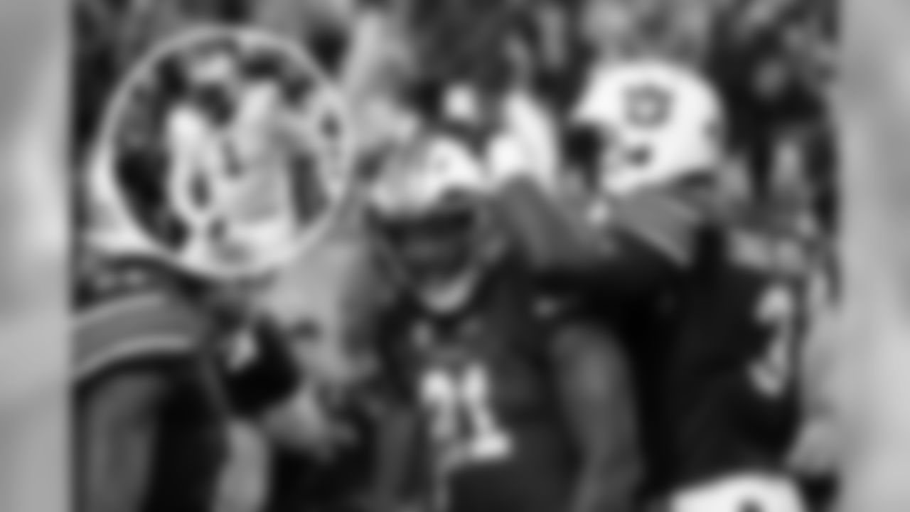 Lions RB **Kerryon Johnson** (center) and Packers DL **Montravius Adams** (left) were teammates together at Auburn from 2015-16.