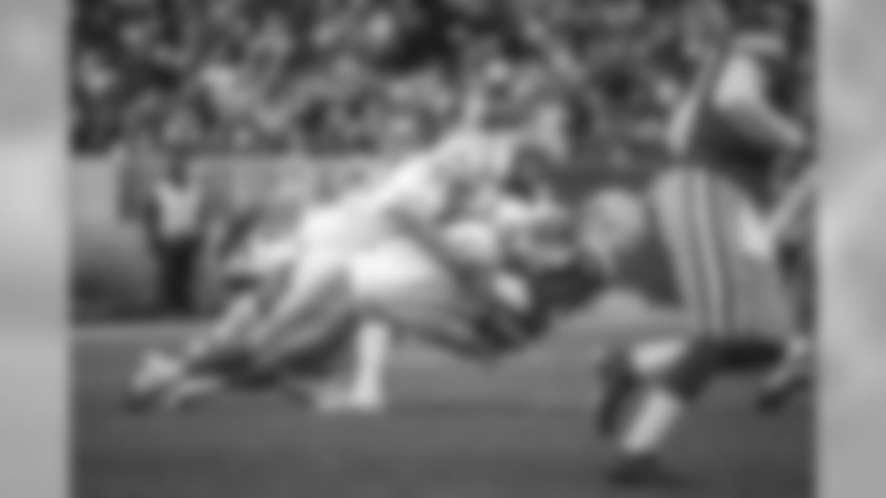 Detroit Lions defensive tackle Damon Harrison (98) and Detroit Lions linebacker Jarrad Davis (40) make a tackle during a NFL football game against the Green Bay Packers on Sunday, Dec. 30, 2018 in Green Bay, Wisc.