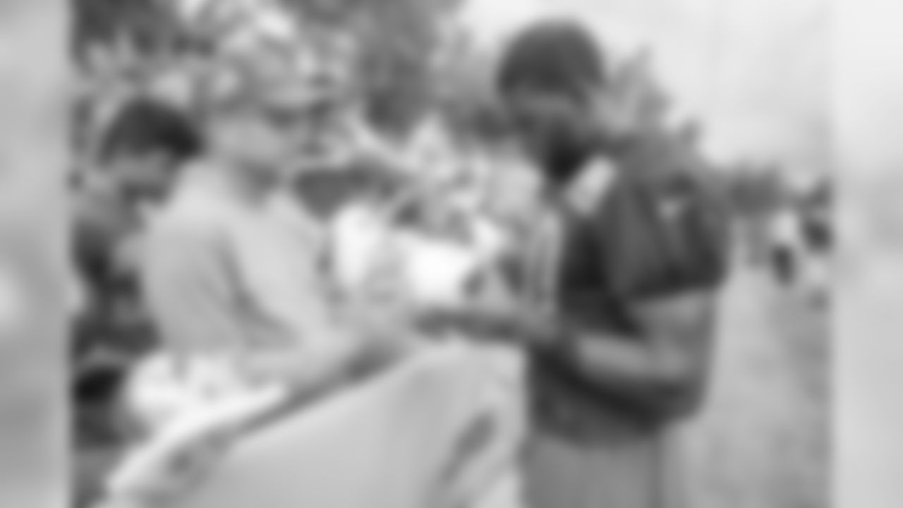 Linebacker Jarrad Davis (40) signs autographs following practice on Day 1 of 2018 Detroit Lions Training Camp presented by Rocket Mortgage on Friday, July 27, 2018 in Allen Park, Mich. (Detroit Lions via AP)