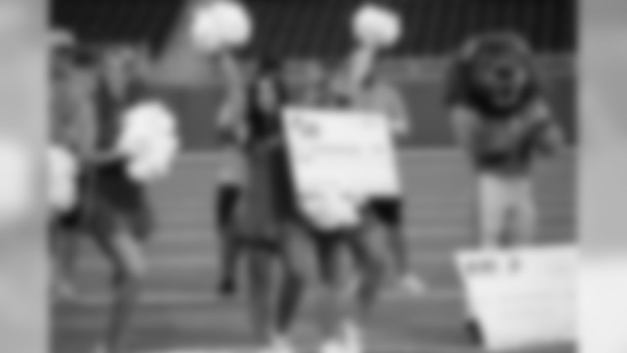 Detroit Lions Cheerleaders present a check to Loyola High School Football Team as part of Touchdown in Your Town on Thursday, June 27, 2019 in Detroit.
