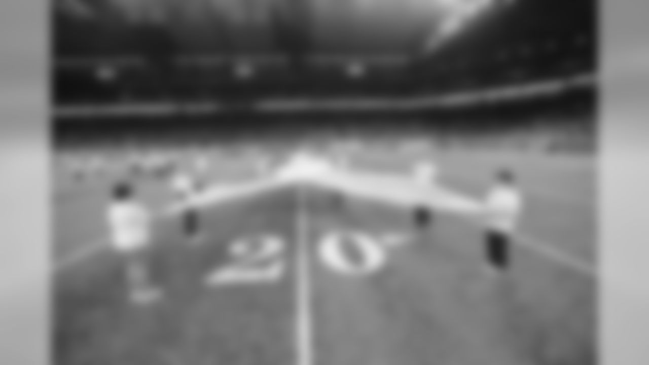 Cancer survivors on the field before a NFL football game against the New York Giants Sunday, Oct. 27, 2019 in Detroit. (Detroit Lions via AP).