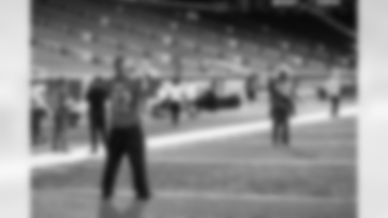 Detroit Legend Eric Stocz with United States veterans and service members gathered at Ford Field for a football clinic. A Detroit Lions Salute to Service initiative presented by Humanetics.