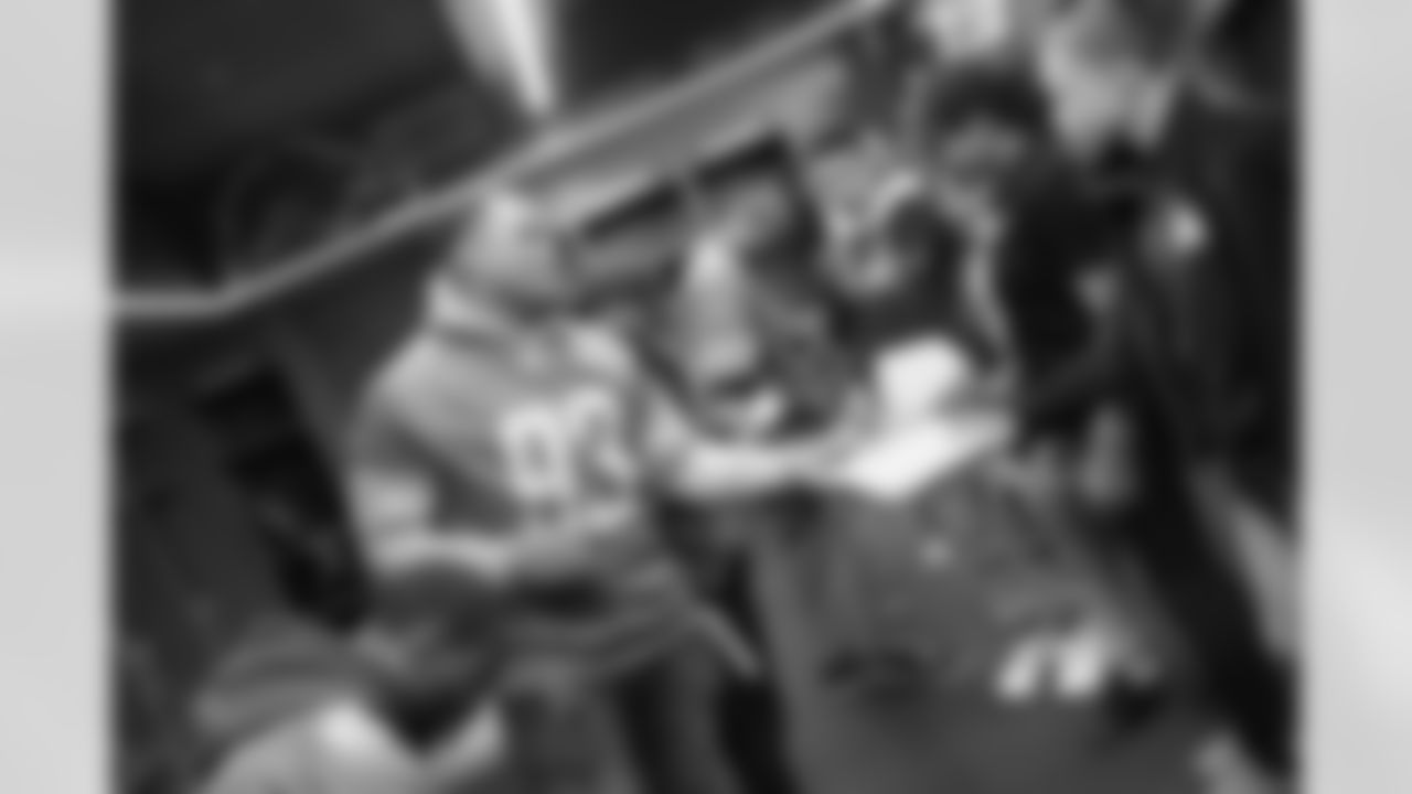 Detroit Lions defensive lineman Da'Shawn Hand (93) at a pizza party with students from Renaissance High School in the Ford Field locker room on Wednesday, May 8, 2019 in Detroit.
