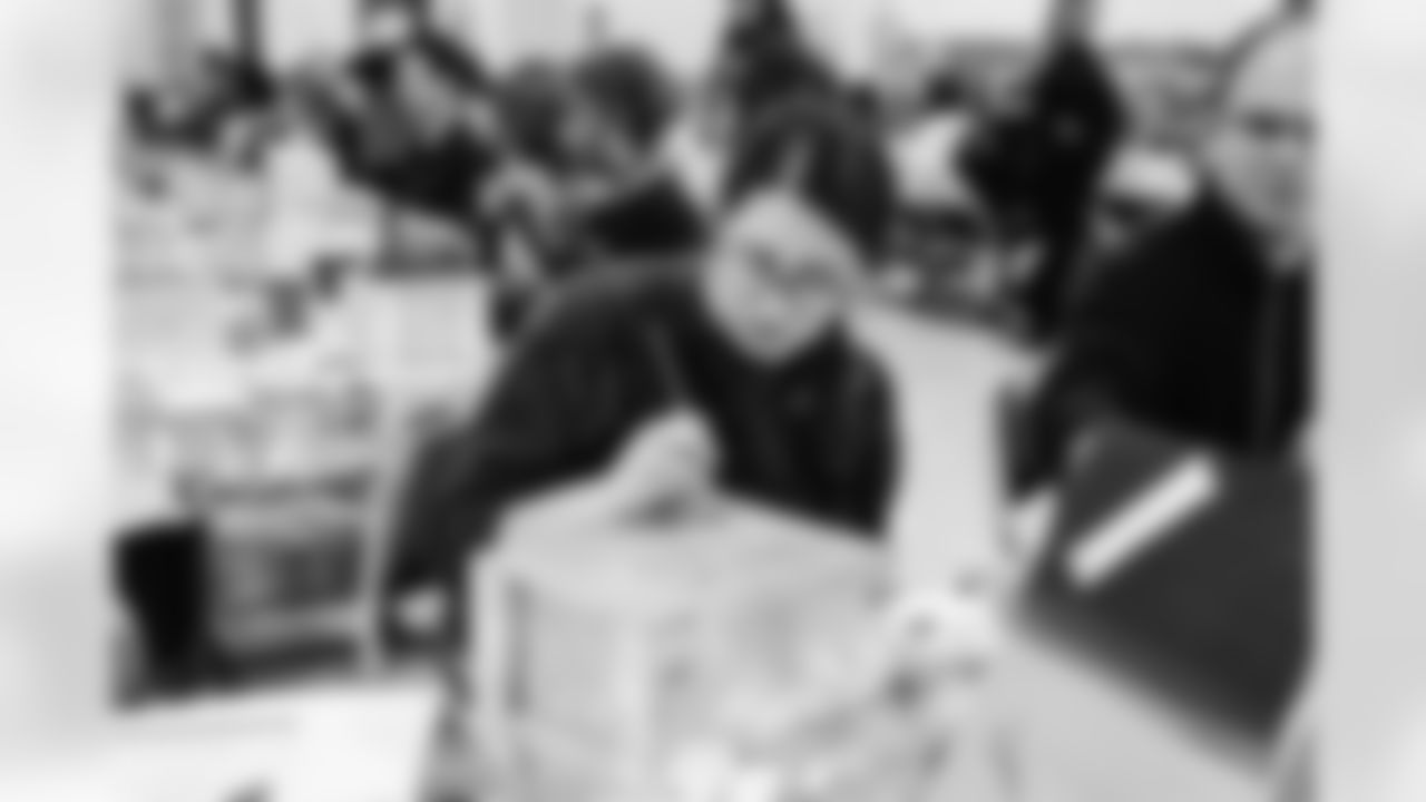 Volunteers from Humanetics joined the Lions and Stronger Warrior Foundation to prepare care packages and letters to be sent overseas to active service members as a part of the Salute to Service initiative on October 28, 2021. (Jeff Nguyen/Detroit Lions)