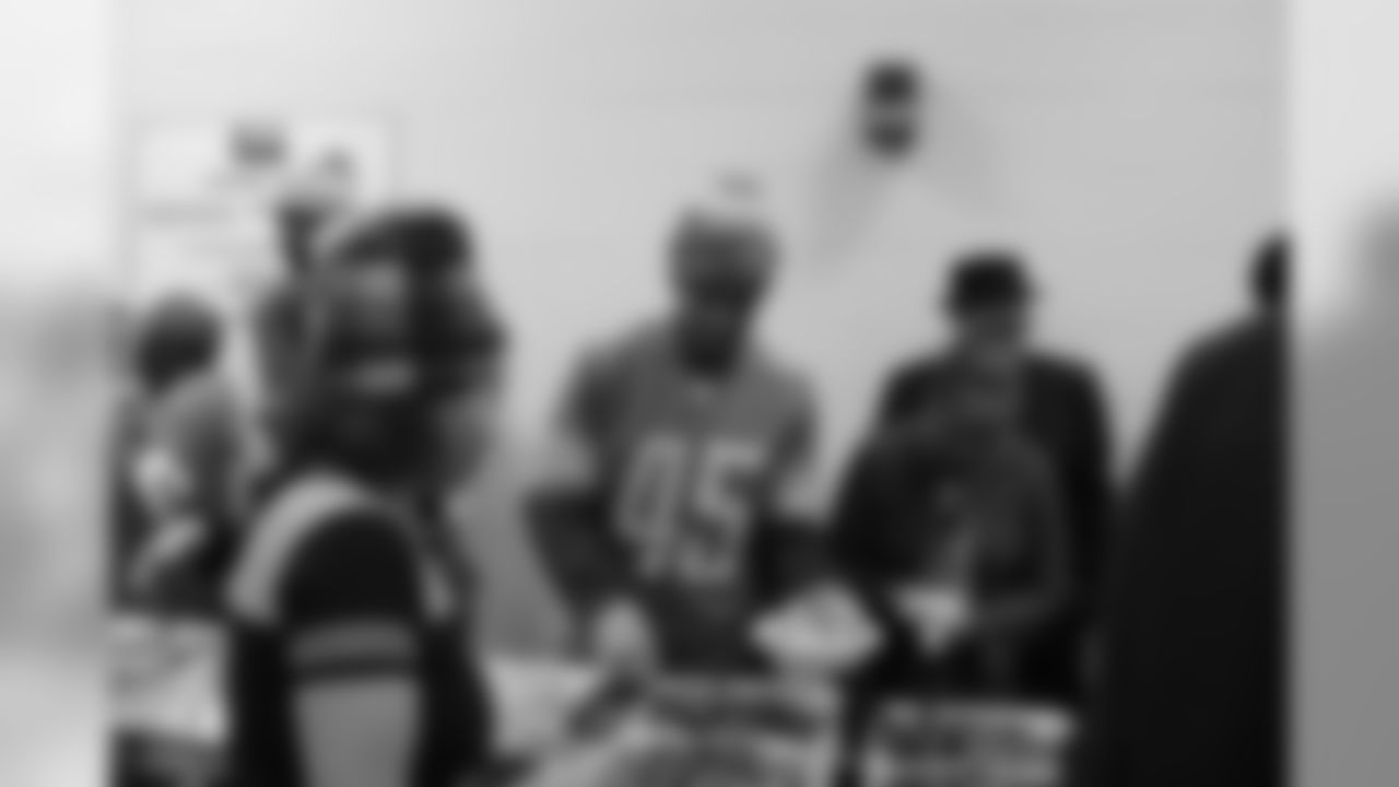 Detroit Lions safety Charles Washington (45) serves Qdoba at Neighborhood Service Organization (NSO) on Tuesday, Nov. 27, 2018 in Detroit.