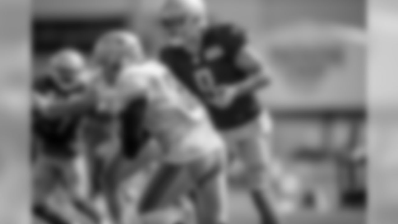 Detroit Lions quarterback Matthew Stafford (9) hands to Detroit Lions running back Kerryon Johnson (33) during Day 6 of Detroit Lions Training Camp presented by Rocket Mortgage on Wednesday, July 31, 2019 in Allen Park, Mich.