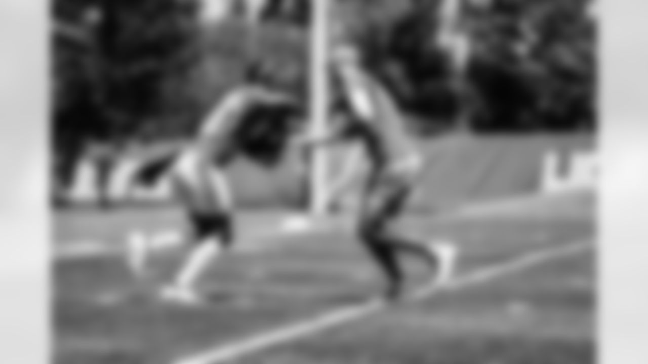 Detroit Lions running back Jamaal Williams (30) and Detroit Lions quarterback Jared Goff (16) during OTAs at the Lions training facility in Allen Park, MI on June 3, 2022. (Josh Mandujano/Detroit Lions)