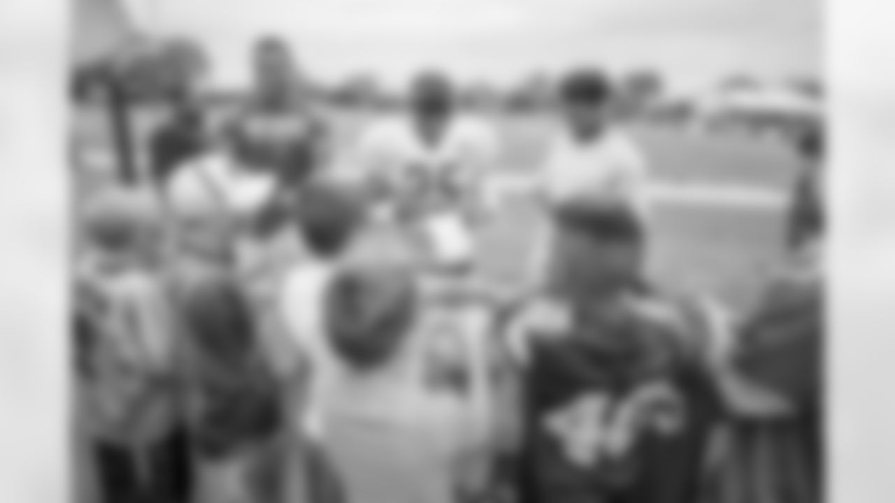 Detroit Lions wide receiver Kenny Golladay, running back Theo Riddick (25) and cornerback Darius Slay sign autographs for fans following training camp practice on Wednesday, Aug. 1, 2018 in Allen Park, Mich. (Detroit Lions via AP)