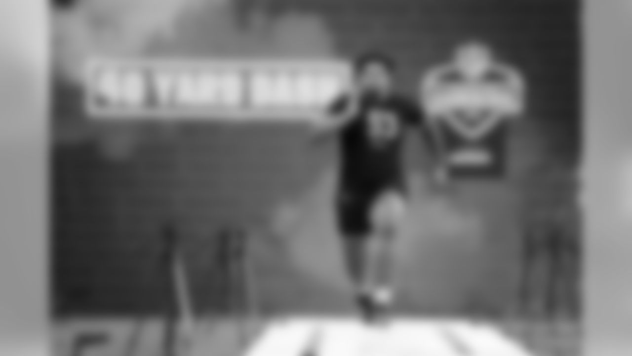 Iowa offensive lineman Tristan Wirfs runs the 40-yard dash at the NFL football scouting combine in Indianapolis, Friday, Feb. 28, 2020. (AP Photo/Charlie Neibergall)