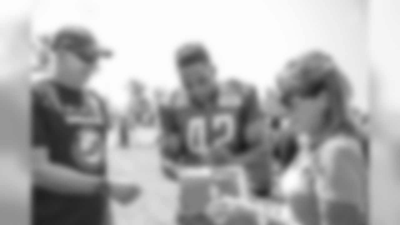 Detroit Lions linebacker Devon Kennard (42) signs autographs for visitors from TAPS (Tragedy Assistance Program For Survivors) following Day 2 of 2019 Detroit Lions Training Camp presented by Rocket Mortgage on Friday, July 26, 2019 in Allen Park, Mich. (Detroit Lions via AP)