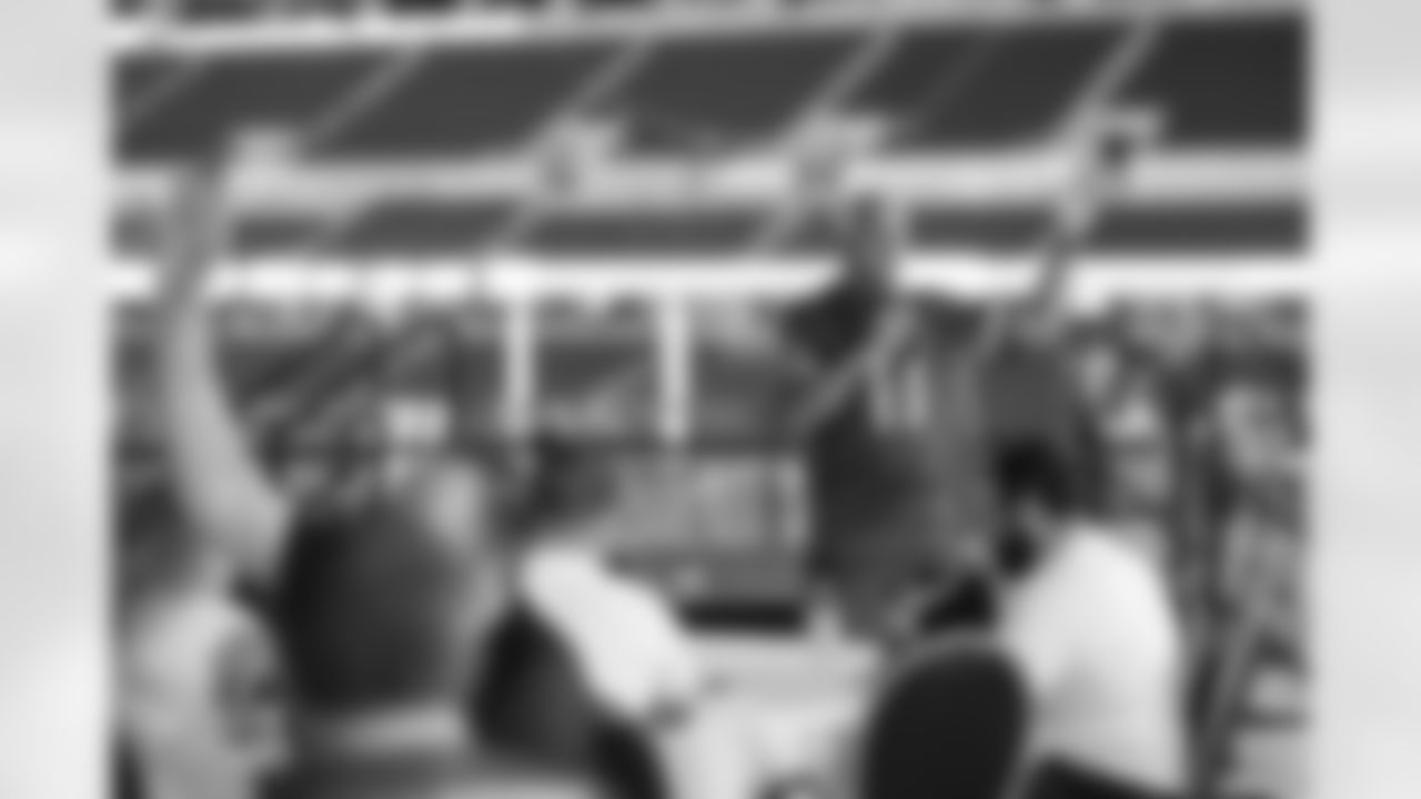 Detroit Legend Eric Hipple, with United States veterans and service members gathered at Ford Field for a football clinic. A Detroit Lions Salute to Service initiative presented by Humanetics.