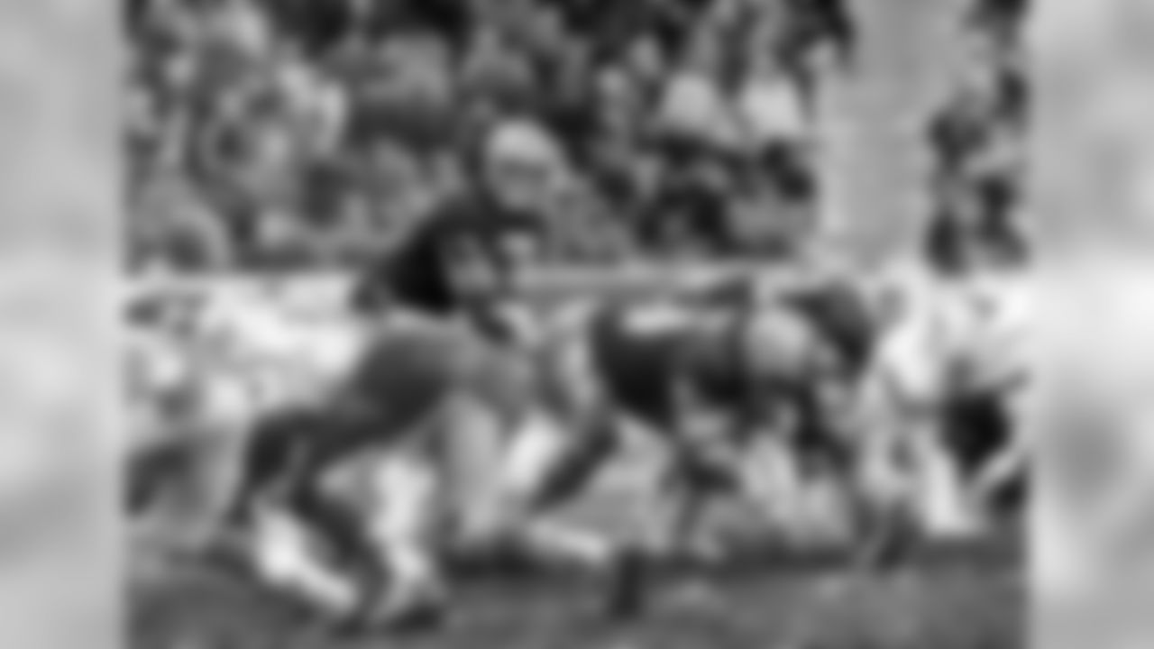 Dec. 4, 1977 - Fighting a piercing 10-degree day at Lambeau Field, the muddied Packers notched a 10-9 victory over the Lions. QB David Whitehurst (17) led the Packers to their first win over the Lions that year.