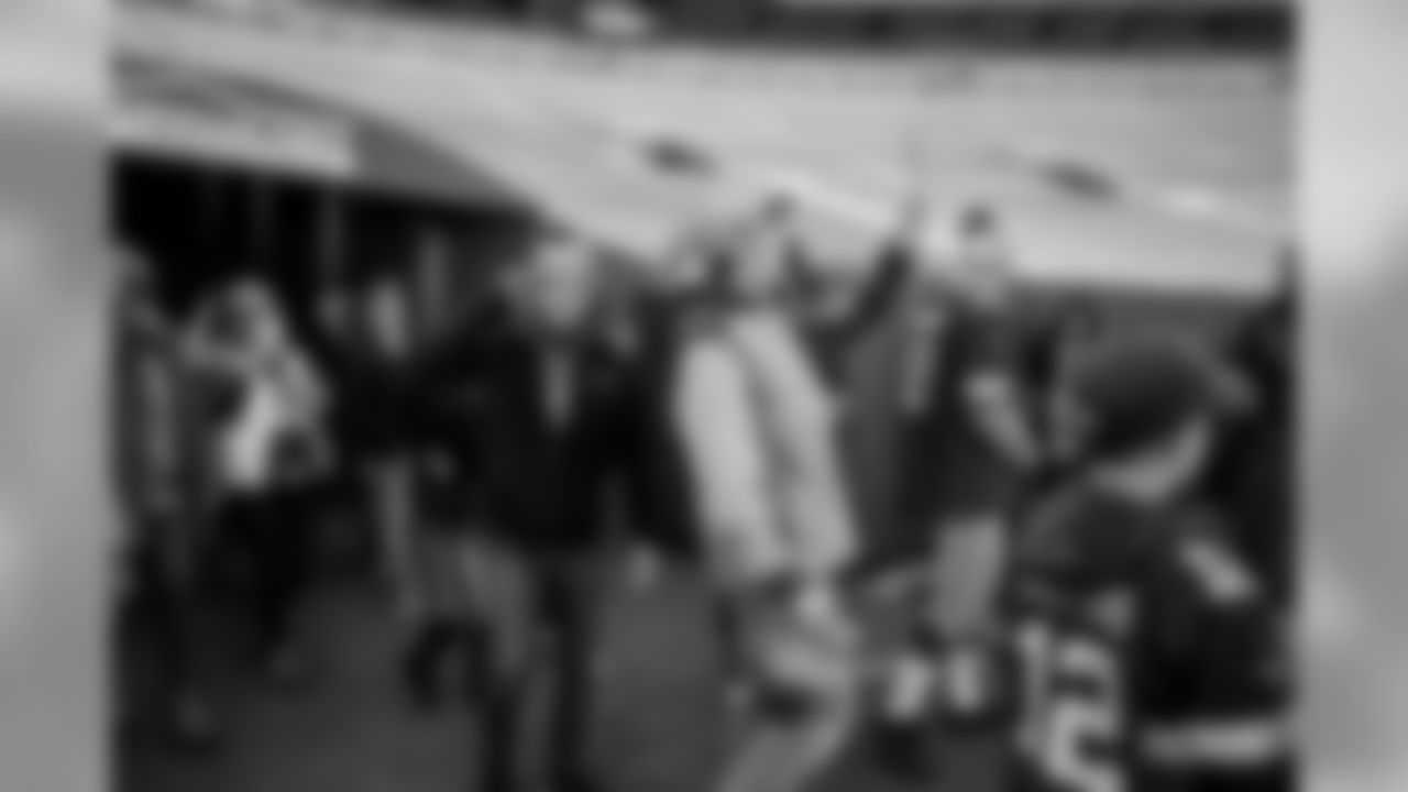 29 Packers fans attempt a Lambeau Leap at Lambeau Field on Saturday, Feb.29.