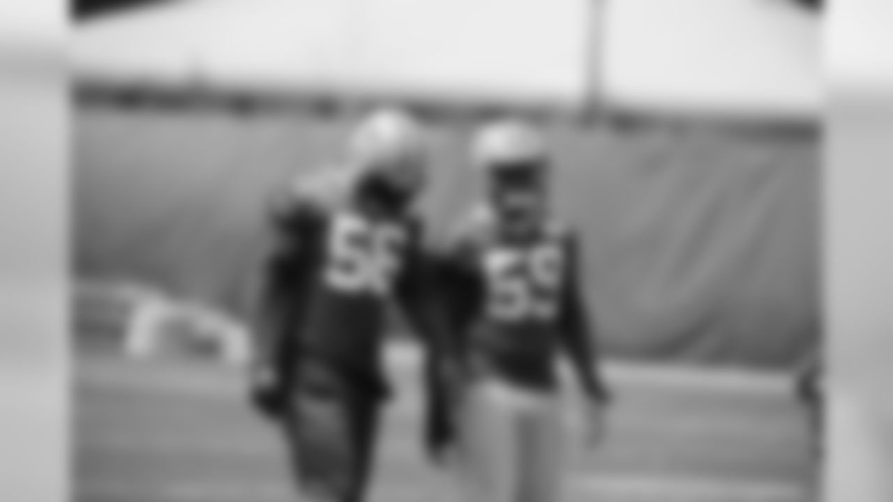 LB Jemauria Rasco (#59) and LB Julius Peppers (#56)