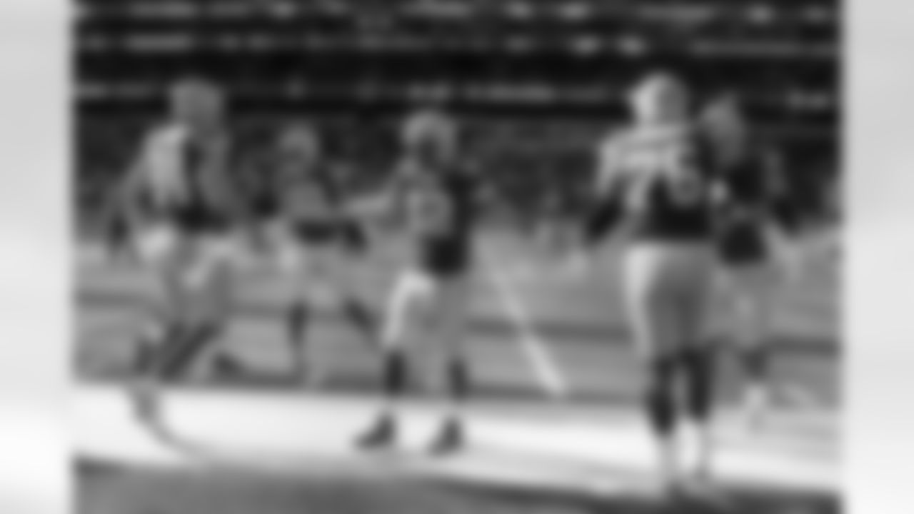Green Bay Packers quarterback Aaron Rodgers (12), centre, takes part in the warm-up before an NFL game between the New York Giants and the Green Bay Packers at the Tottenham Hotspur stadium in London, Sunday, Oct. 9, 2022. (AP Photo/Alastair Grant)