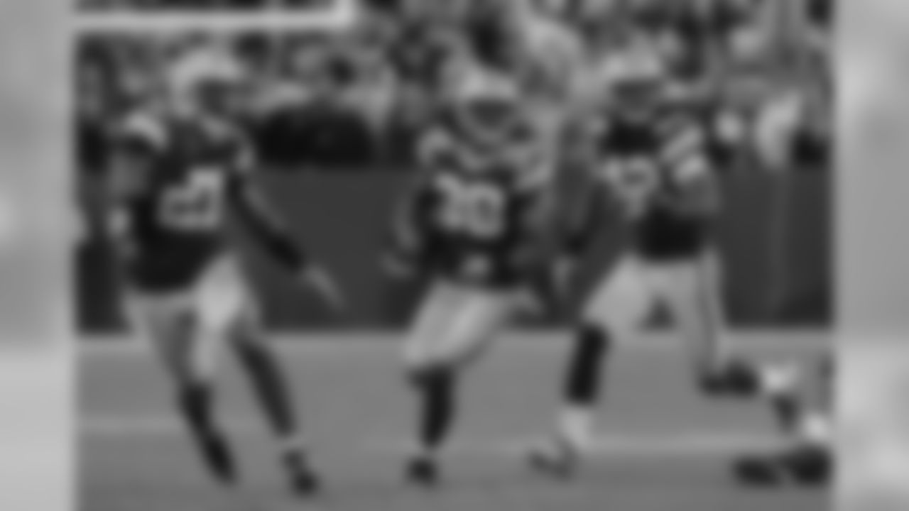 CB Tramon Williams runs back one of his two interceptions of Jay Cutler. Williams' two INTs set up a field goal and touchdown for the Packers.