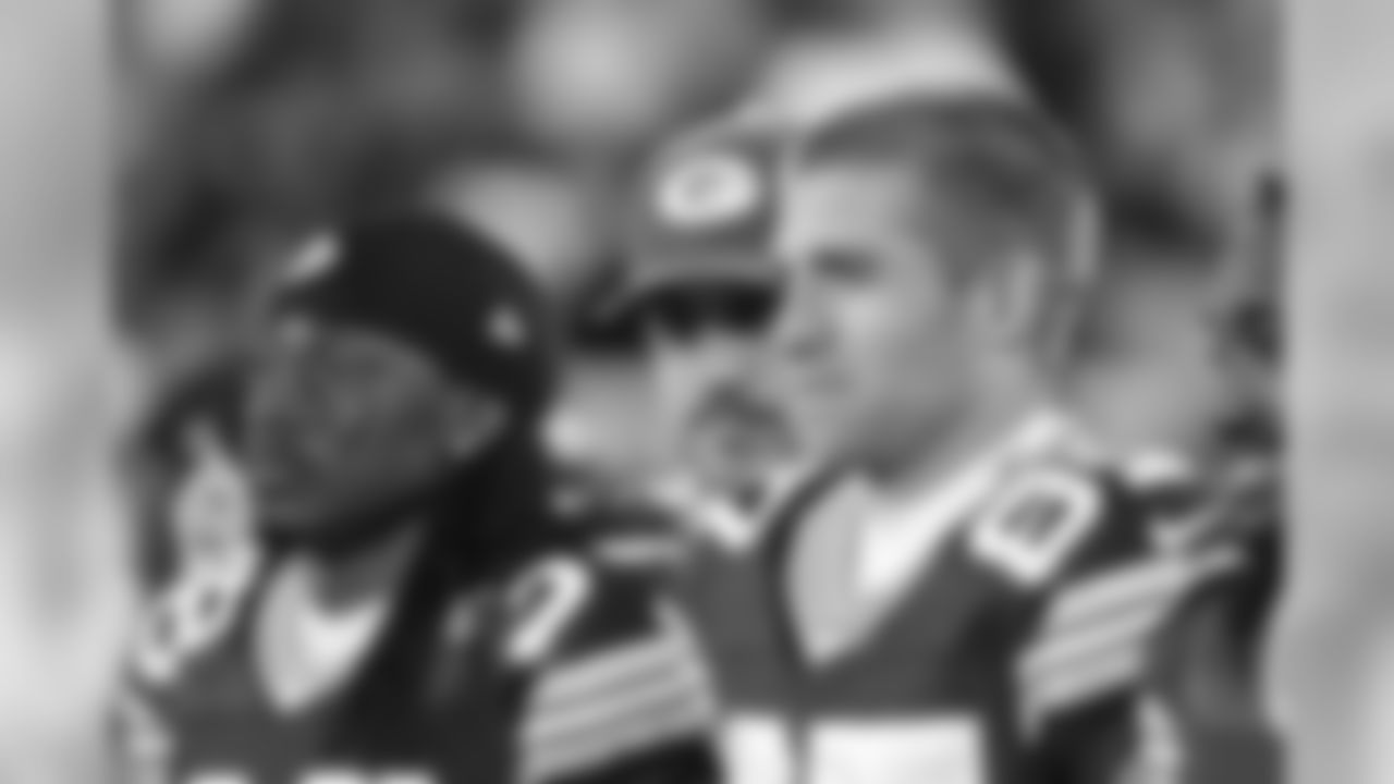 WR Jordy Nelson posing for the pregame captains photo with QB Aaron Rodgers photo-bombing in the background.