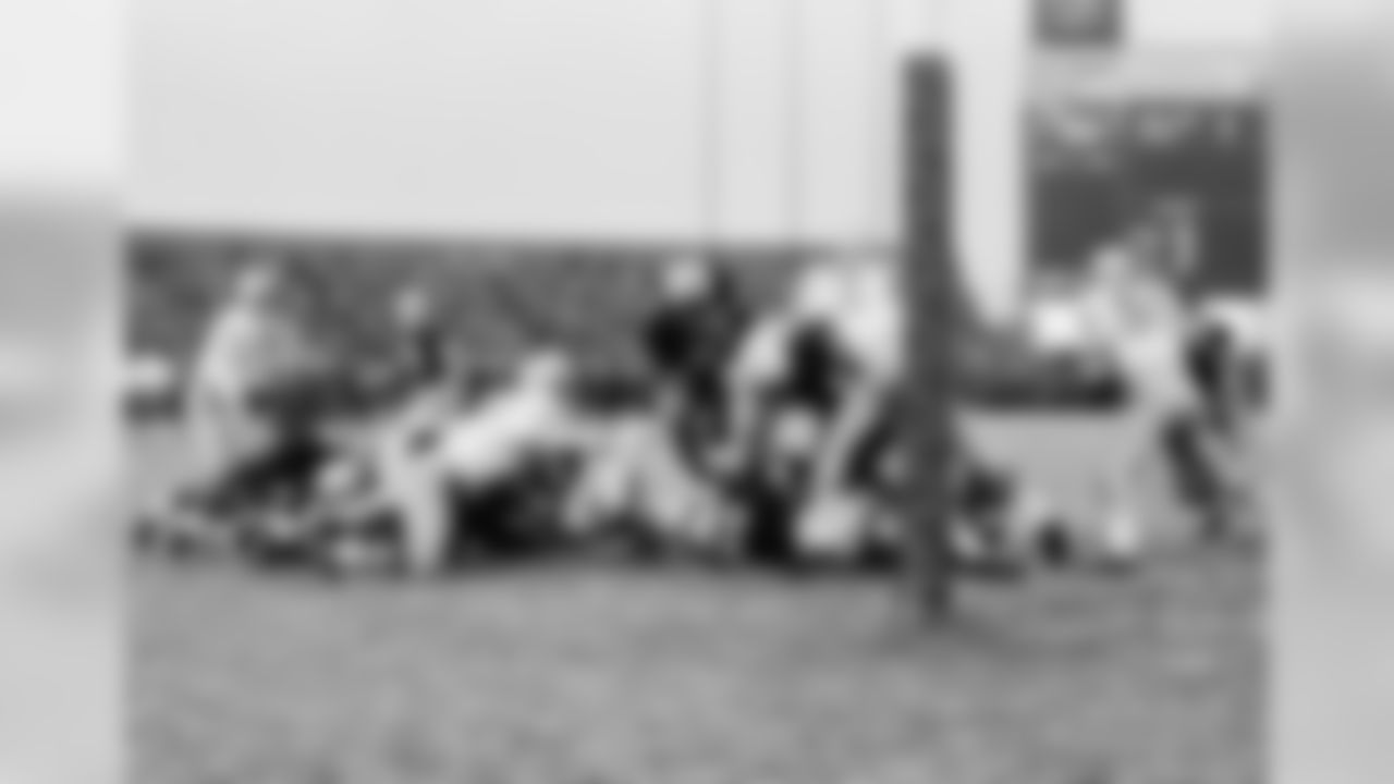 Dec. 5, 1966 - RB Elijah Pitts leaps across the goal line for a touchdown as QB Bart Starr (15) looks on in Milwaukee, Wisc. The Packers won, 20-7, clinching a tie for first place in the NFL Western Division.