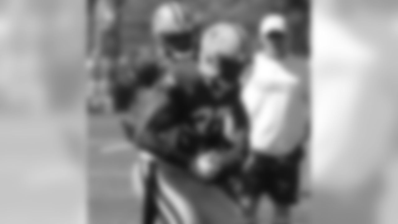 Charles Woodson and Aaron Rouse