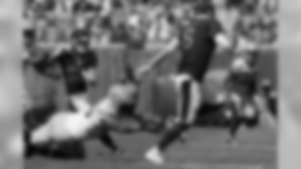 He was named the NFL Defensive Rookie of the Year by AP in 2002 after recording 12 sacks for the Carolina Panthers in his debut season.